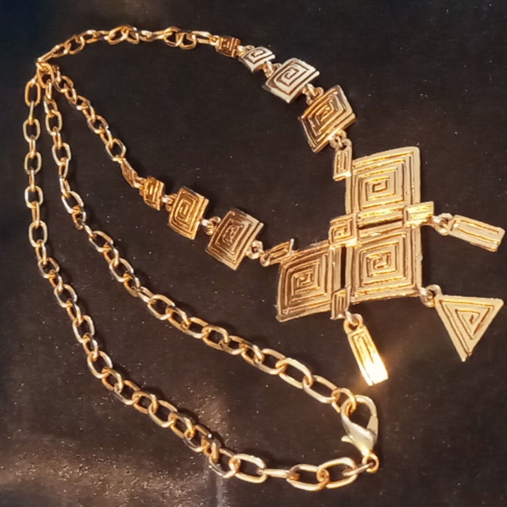 Gold tone bib necklace 38 inches long statement piece.